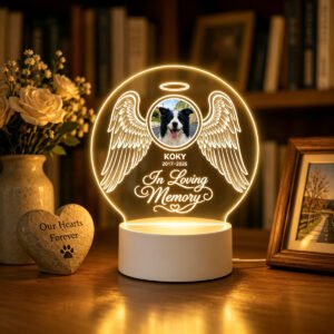 Personalized pet memorial frame with angel wings design softly lit at night, a warm pet remembrance keepsake